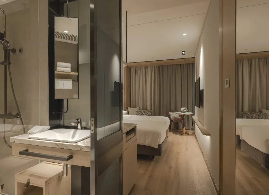 Premier Triple Room at Dorsett Kai Tak Hotel, Hong Kong with modern design