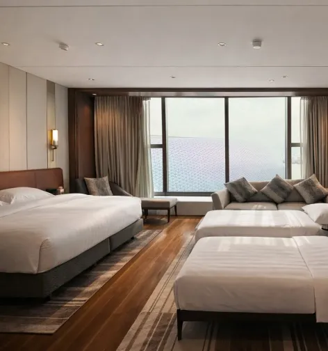Modern guest room at Dorsett Kai Tak Hotel, Hong Kong with large window view