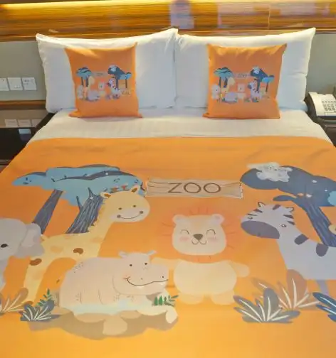 Zoo themed king bed in the Dorsett Room.