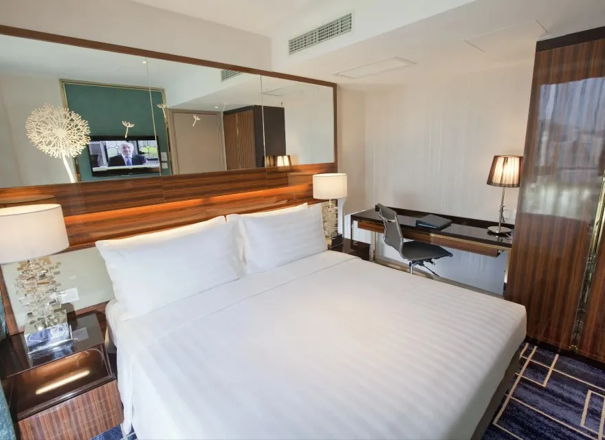 King bed and wall-mirror in the Family Suite, Dorsett Tsuen Wan.