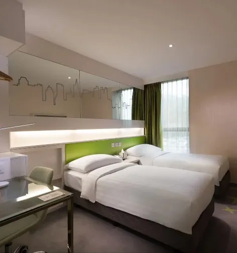 Twin beds in the Greenery Room at Dorsett Tsuen Wan.